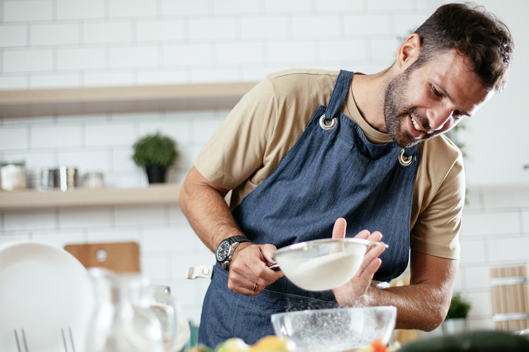 A man preparing a meal at home