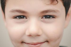 a close-up of a young boy’s eyes