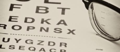 eye chart exam and glasses