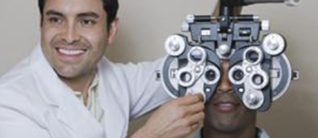 eye care practitioner smiling during eye exam