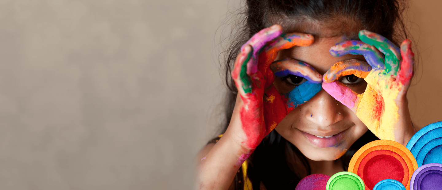 young girl finger painting