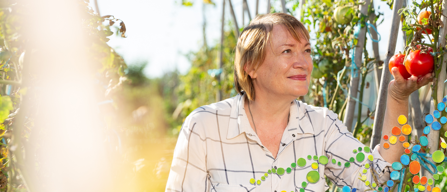 mature woman smiling in a garden