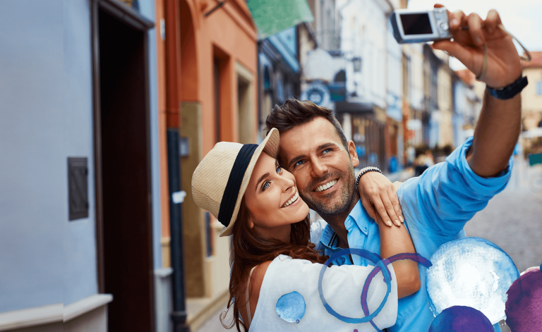 man and woman smiling and taking a picture