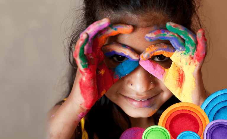 young girl finger painting