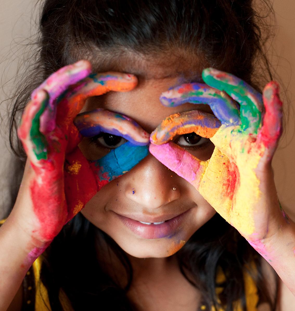 young girl finger painting