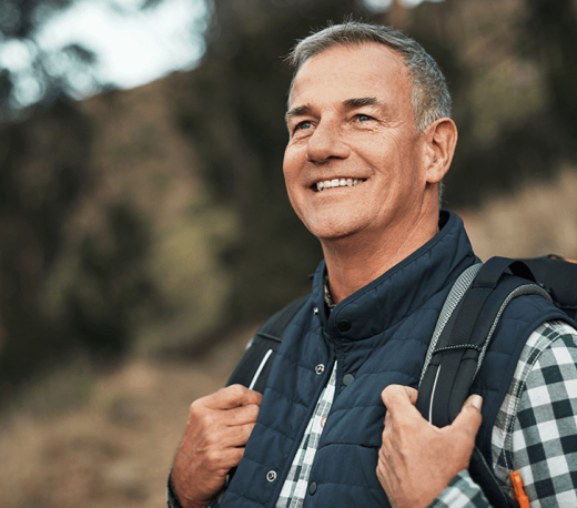 man smiling outdoors